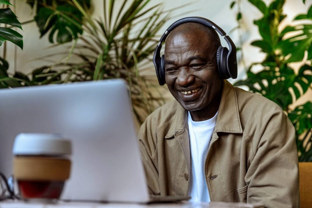 person with headphones at a computer