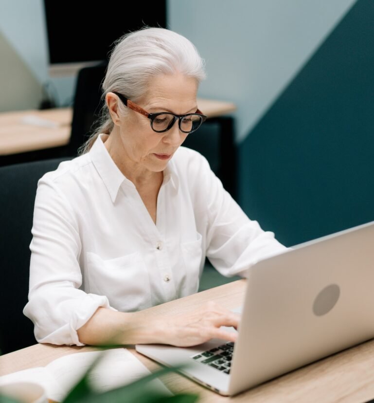 woman typing on laptop